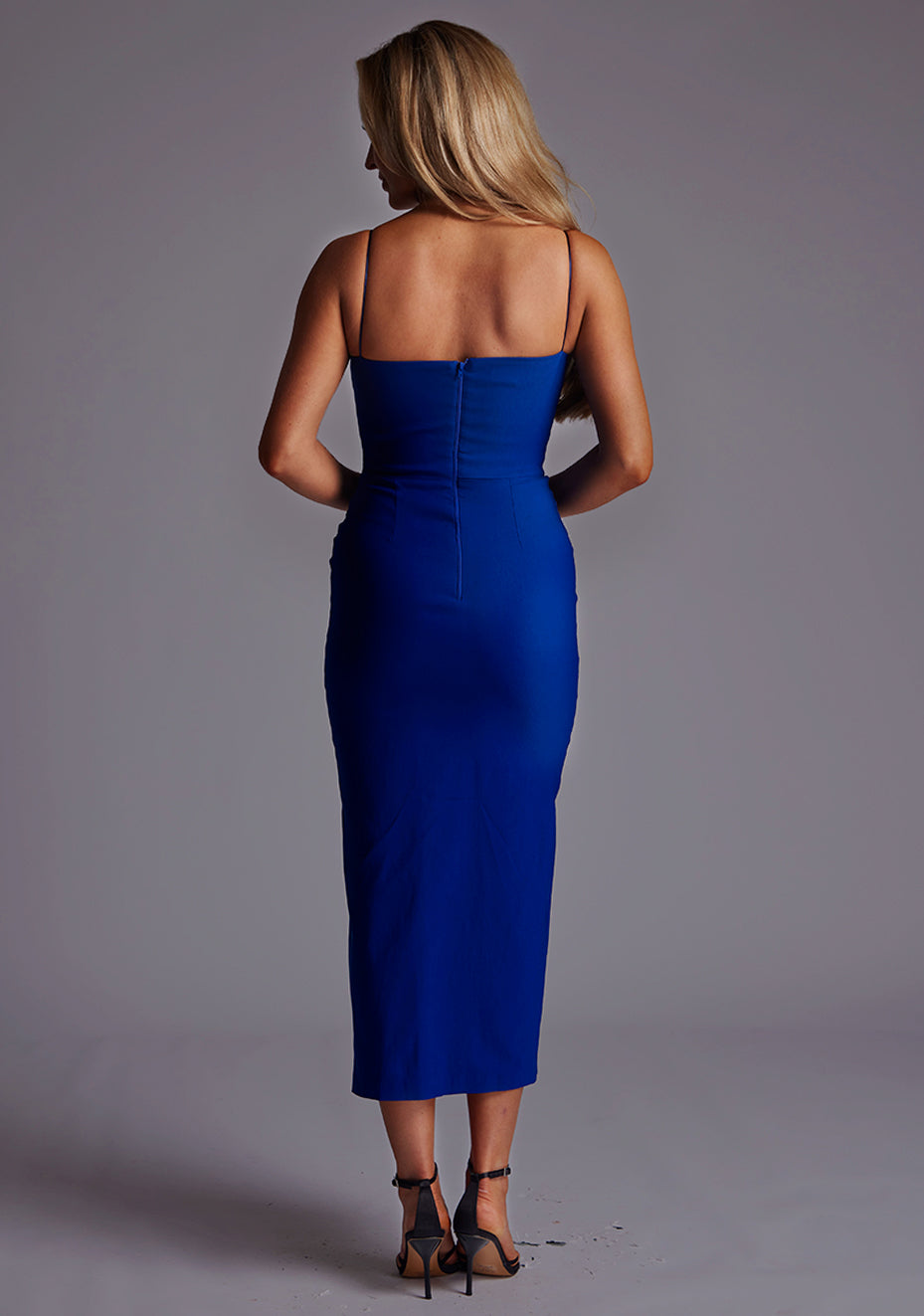 Back image of a model wearing the VSPR Alex Sweetheart Neckline Cobalt Midaxi Dress, showcasing the sleek fitted silhouette, rich cobalt colour, and sophisticated midaxi length.