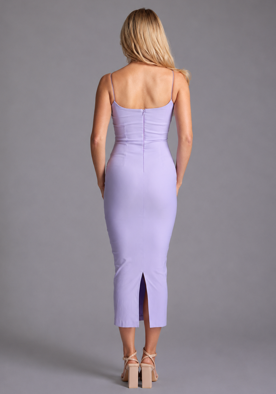Back image of a model wearing the VSPR Maddie Spaghetti Strap Bodycon Midaxi Dress in Lilac, emphasizing its minimalist detailing, slim shoulder straps, and elegant midaxi length.