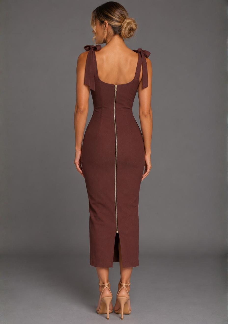 Back image of a model wearing the VSPR Rapunzel Ruched Bust Bodycon Chocolate Midaxi Dress in Chocolate, highlighting the sleek bodycon shape, delicate straps, and refined midaxi-length finish against a grey studio backdrop.