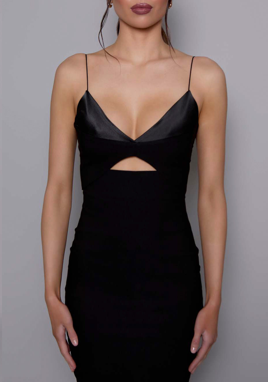 Close-up of the VSPR Angelina dress highlighting the structured satin bust and central cut-out, emphasizing the luxurious texture and precise tailoring.