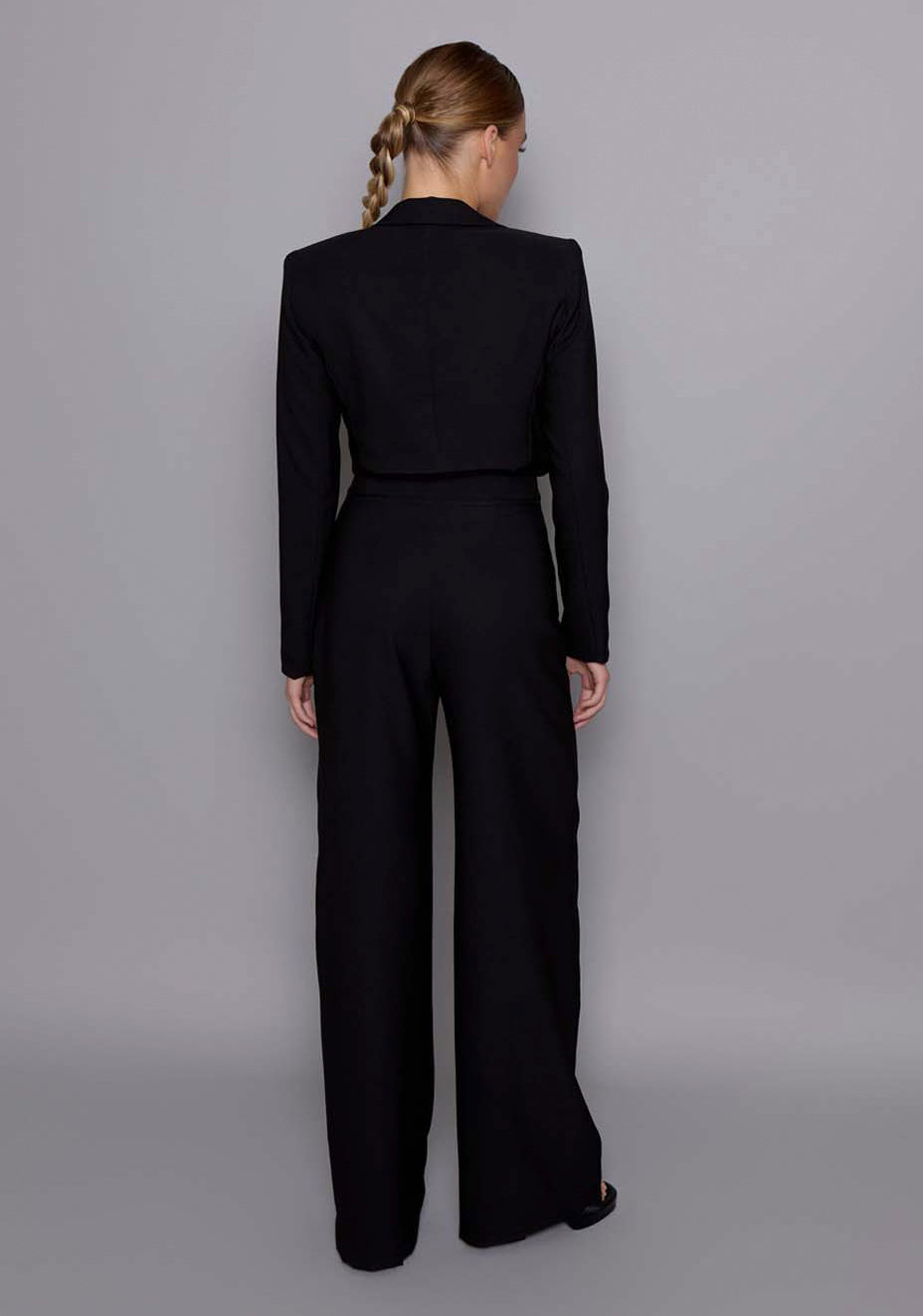 Back view of the VSPR Aria black jacket revealing a clean tailored finish, structured shoulder line, and contoured silhouette from behind.