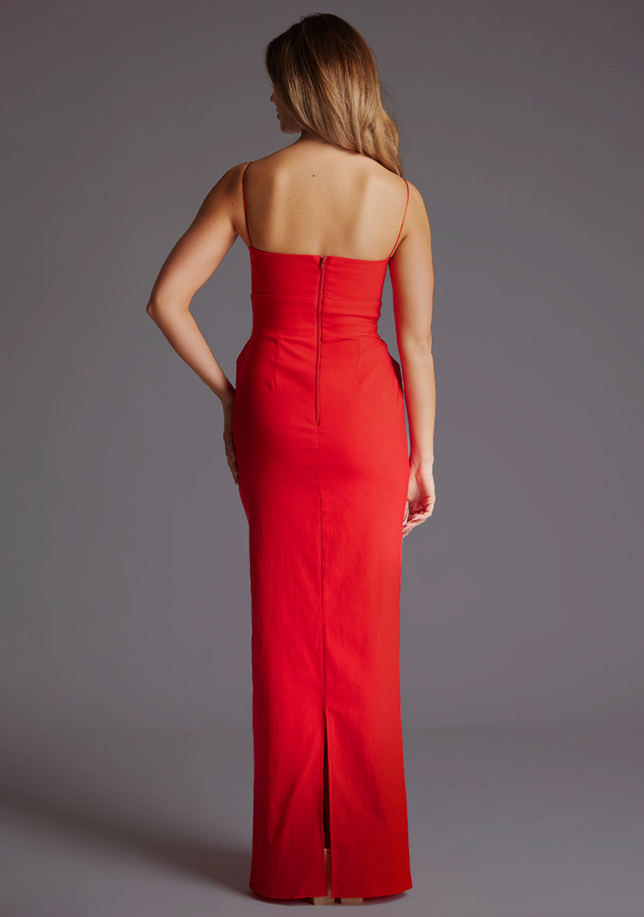 ack image of a model wearing a red square neck maxi dress with a chic straight neckline, delicate thin straps and sleek slim fit. The design featured is the Vesper Bergen Maxi Dress