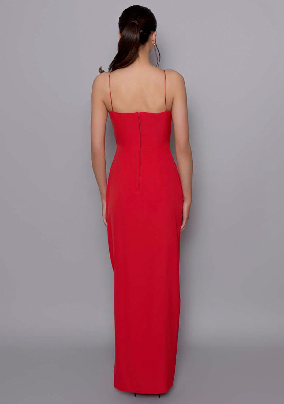 Back view of the VSPR Ellesse red maxi dress featuring slender spaghetti straps and straight floor-length hem, emphasizing the minimalistic, open-back design.