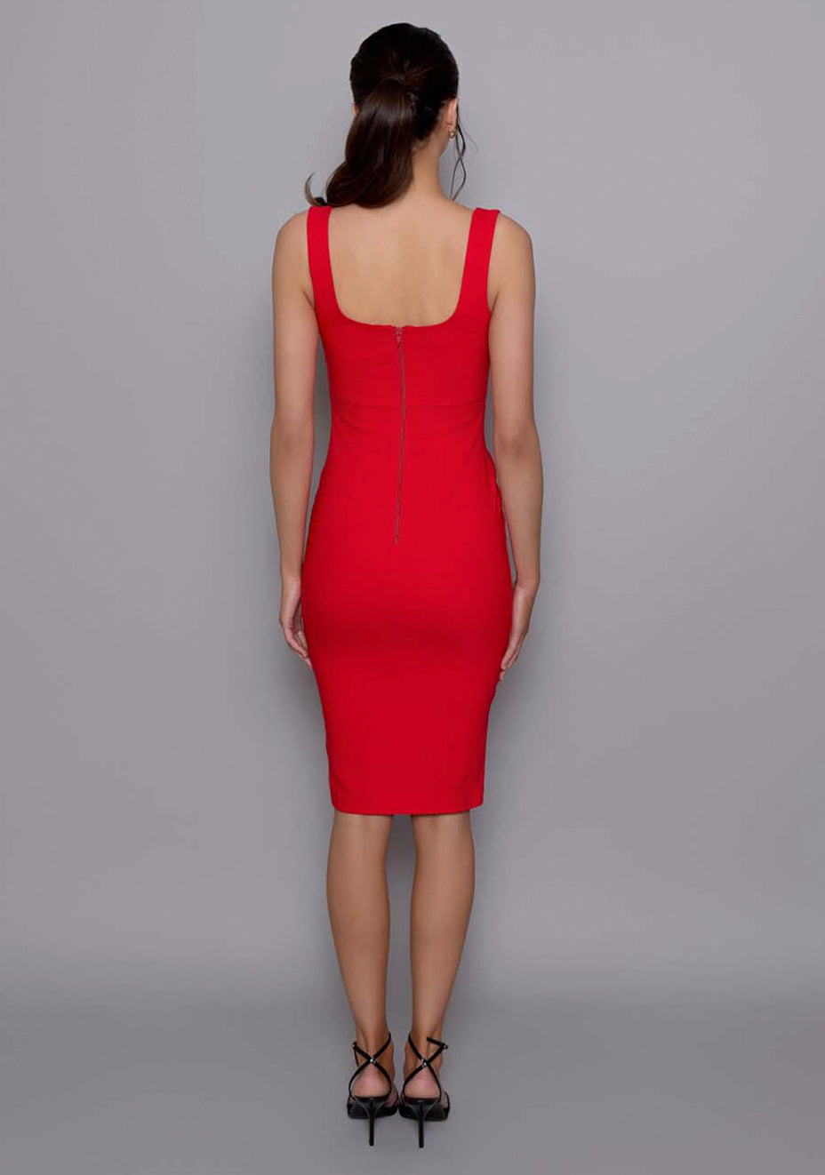 Back view of the VSPR Evette red midi dress with wide straps and zip closure, showcasing the smooth fit and contouring back seam structure.