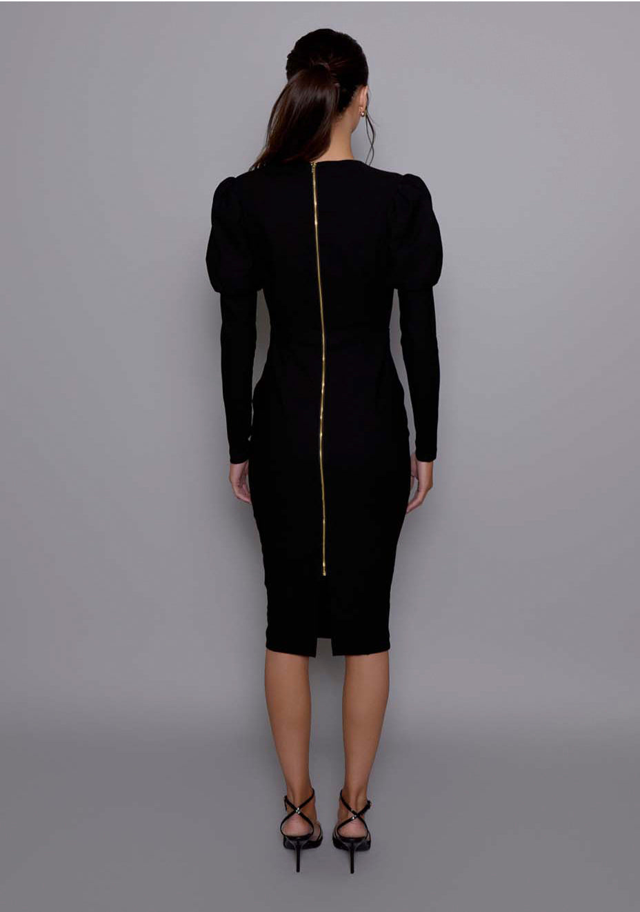 Back view of the VSPR Lyra black dress featuring gold zip closure, curve-enhancing fit, and soft gathering at the waistline, styled with coordinating Seraphina underwear set.