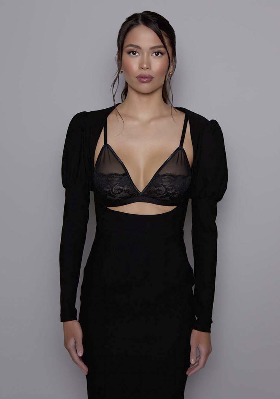 Close up of the VSPR Lyra Sculpted Midaxi Dress highlighting the contoured bodice and puffed shoulder details, showing the smooth fabric texture and sculpted design.