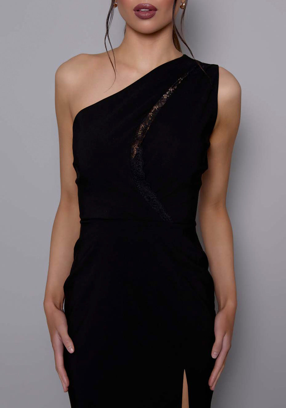 Close-up of the VSPR Madison dress highlighting the lace-trimmed front cut-out and sculpting stretch fabric, showcasing the refined texture and modern asymmetrical neckline.