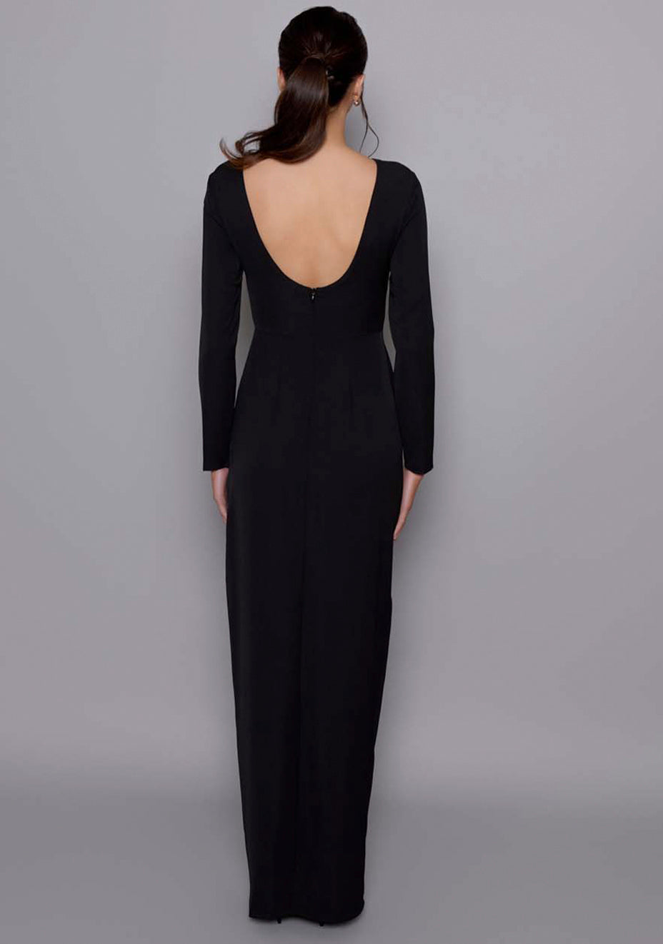 Back view of the VSPR Mandy Black Maxi Dress emphasizing the scoop back design and long sleeves, creating a refined and elegant silhouette.