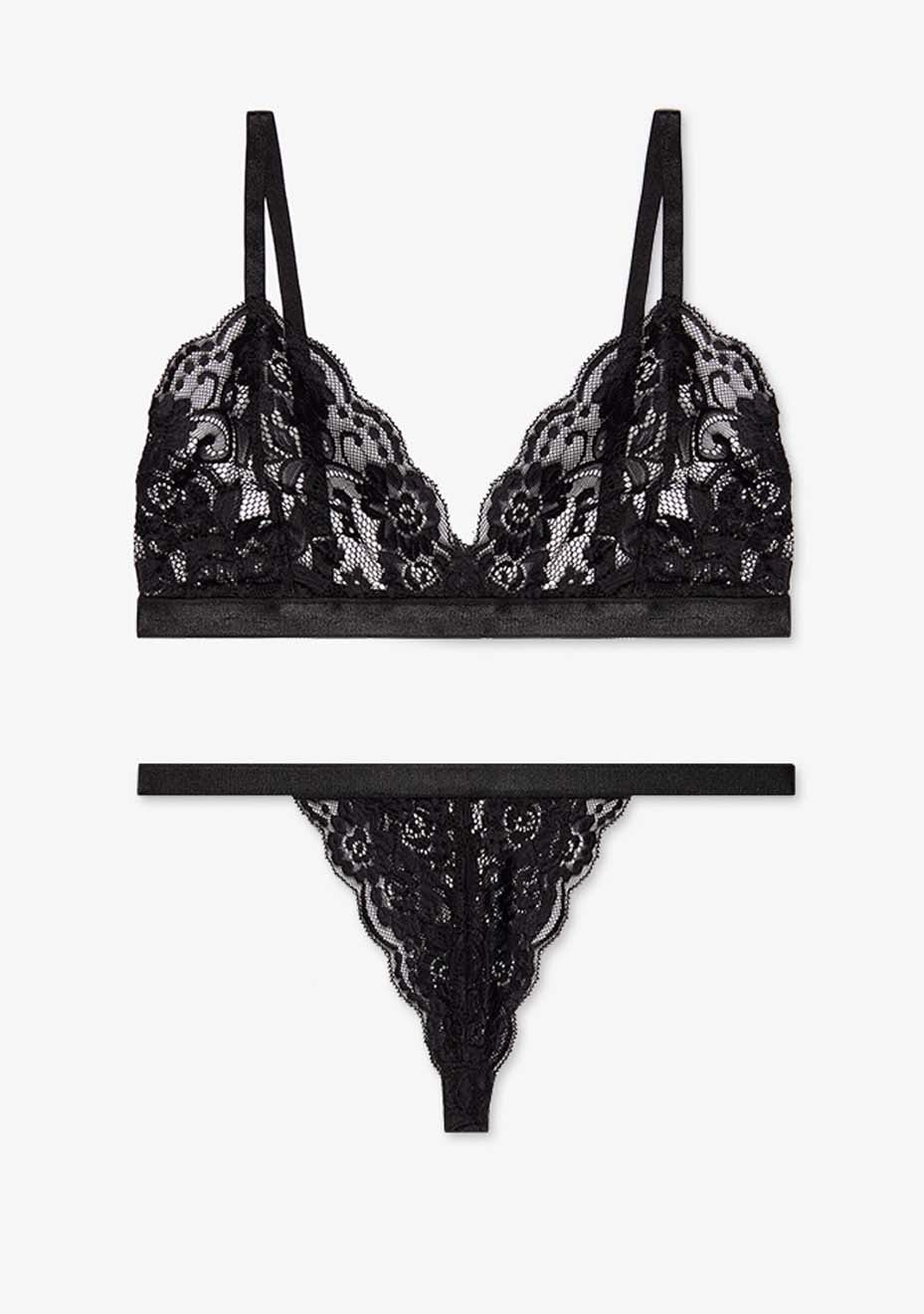 Orla black lace underwear set with delicate flower details, including a bra and thong, styled against a soft white background.