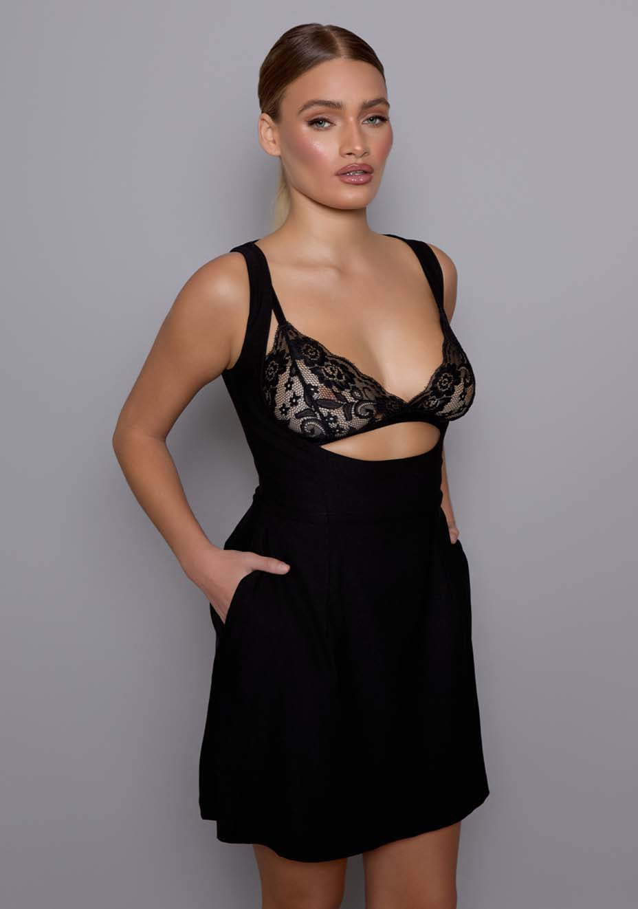 Close-up side-front of the VSPR Orla dress focusing on the open bodice, square neckline, and wide straps, revealing the intricate lace detailing of the Celine bralette beneath the sheer overlay.