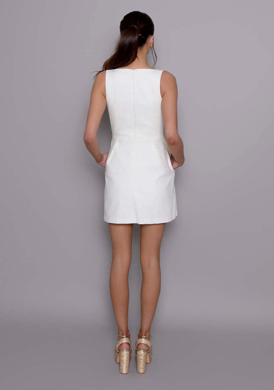 Back view of the VSPR Orla ivory mini dress, showing the elegant A-line overlay and soft draping, with a glimpse of the layered design and wide straps.