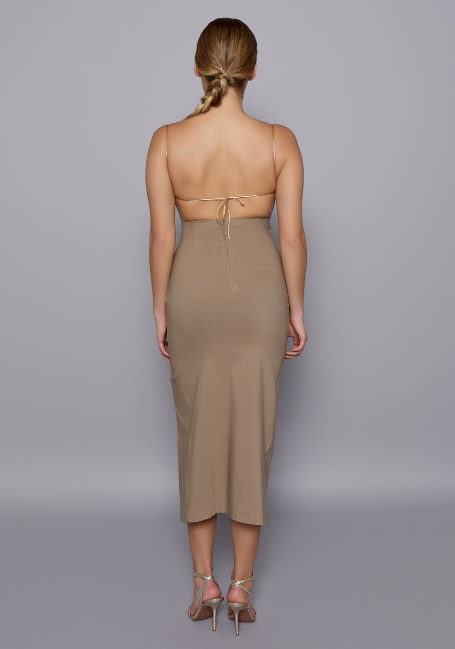 Back view of the VSPR Sandra dress featuring a bold open back with adjustable multi-way tie-up detail, capturing the sculptural fit and elevated elegance.