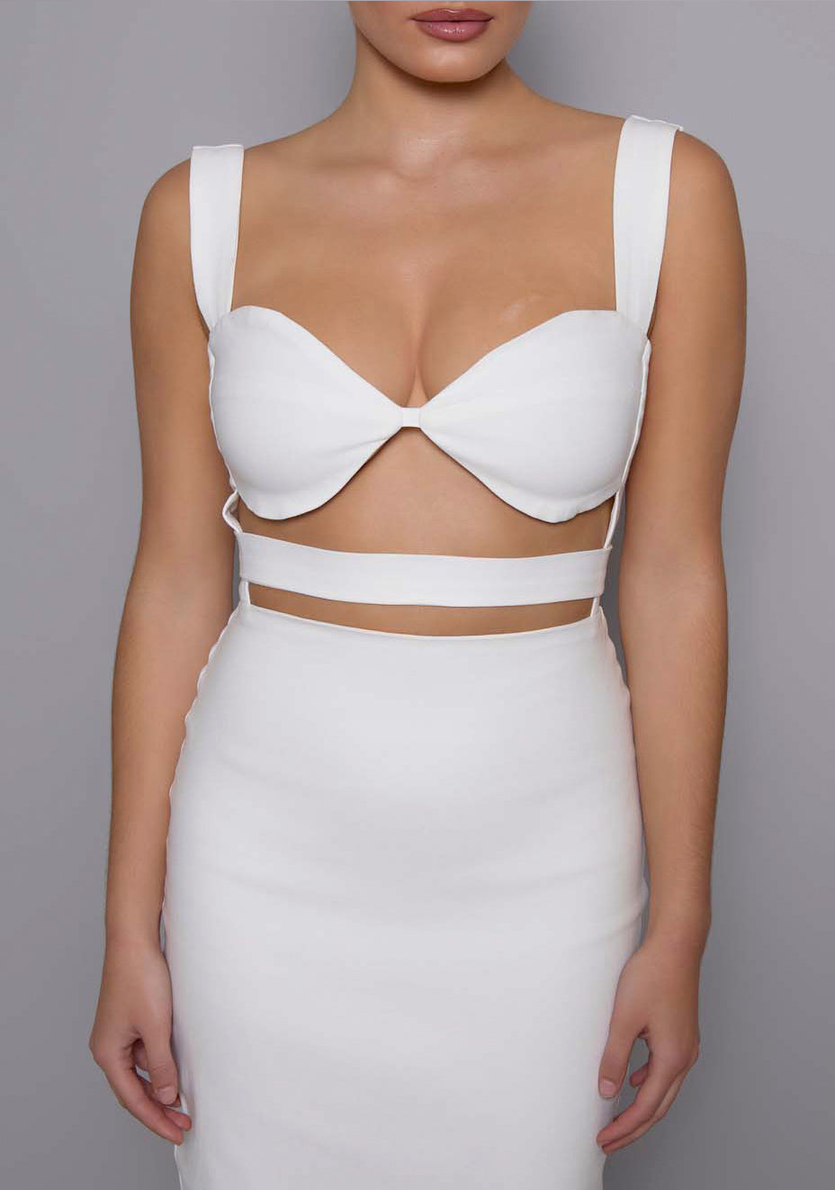 Close-up of the VSPR Solene ivory dress highlighting the structured sweetheart neckline and under-bust cut-outs, showcasing the premium stretch fabric and smooth finish.