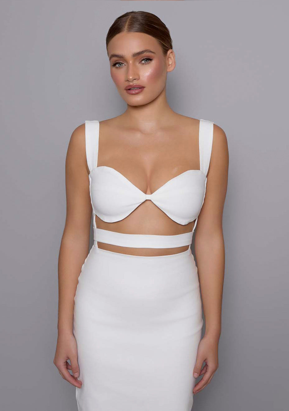 Close-up of the VSPR Solene ivory dress highlighting the structured sweetheart neckline and under-bust cut-outs, showcasing the premium stretch fabric and smooth finish.