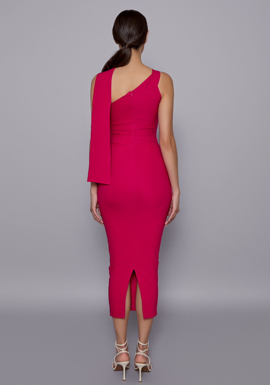 Back view of the Vesper Everest Dress in Cerise featuring a clean zip closure and body-hugging shape that follows the natural curve of the back.