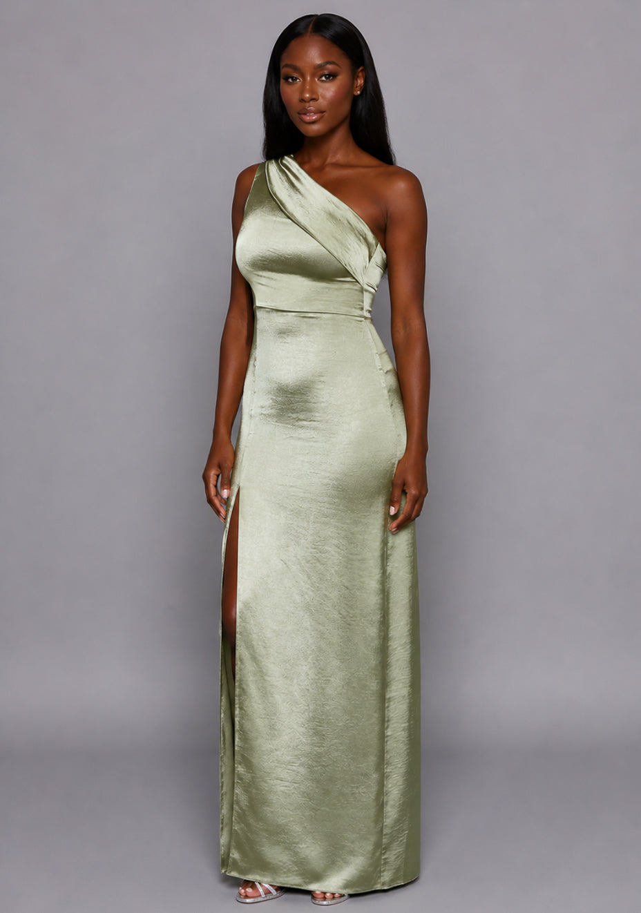 Side front image of a model wearing the VSPR Pandora Paisley Print Midi Dress featuring a halterneck neckline, front cut-out detail and figure-contouring midi silhouette against a grey studio backdrop