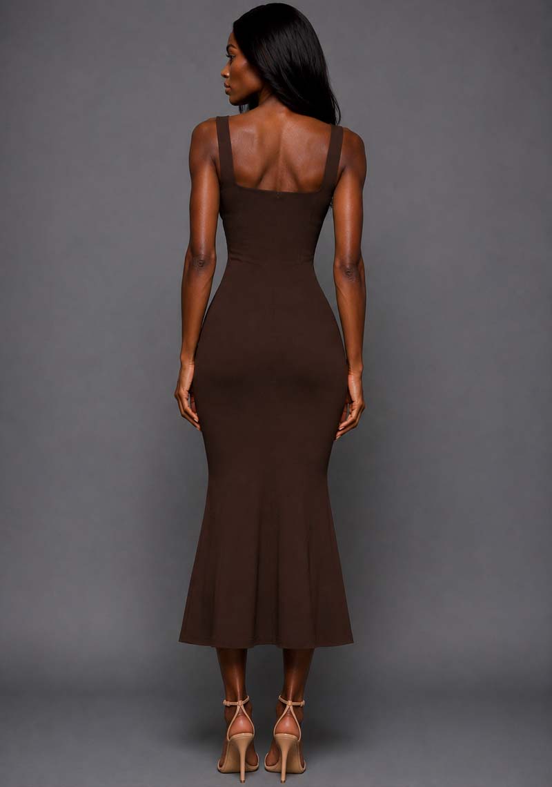 Back image of a model wearing the VSPR Marianna Chocolate Brown Midaxi Dress featuring a sculpted body-skimming back fit, wide straps and graceful fishtail design against a grey studio backdrop.