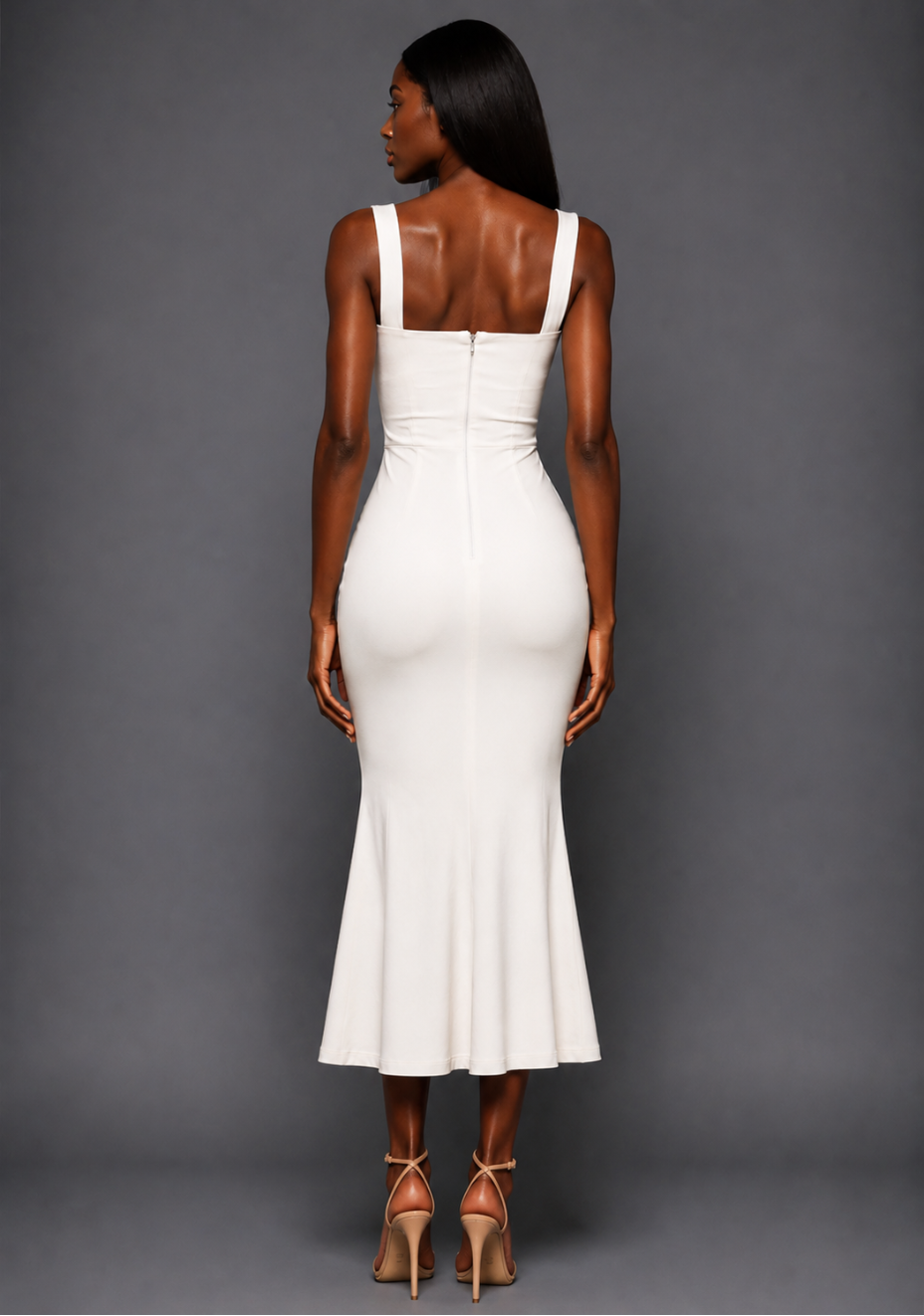 Back image of a model wearing the VSPR Marianna Square Neckline Fishtail Midaxi Dress in Ivory, showcasing the elegant fitted silhouette and softly flared mermaid hem against a grey studio backdrop.