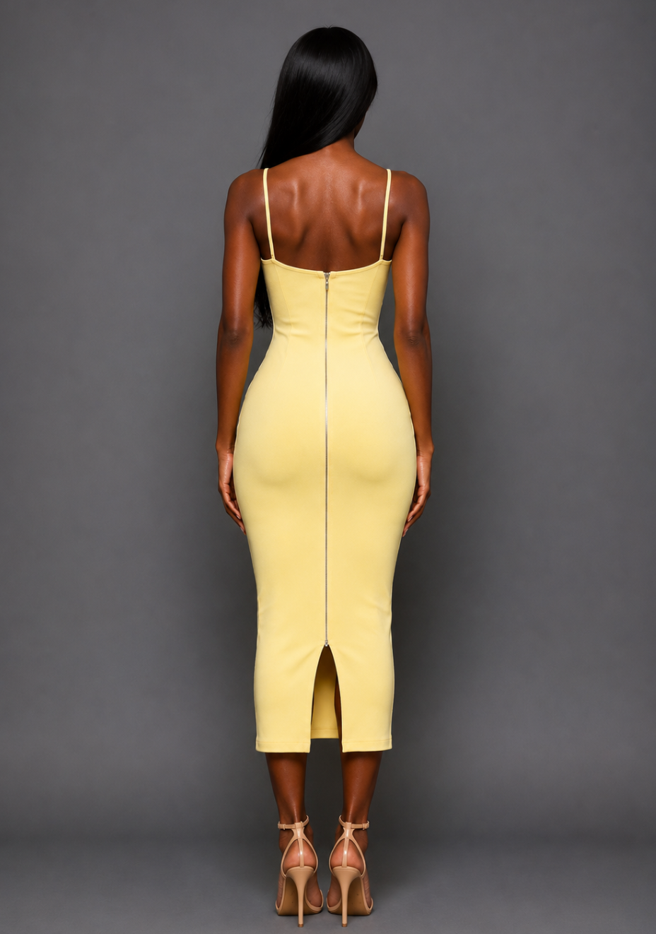 Back image of a model wearing the VSPR Nixi Square Neckline Midaxi Dress in Lemon, featuring the statement gold centre-back zip, fitted silhouette, and midaxi length against a grey studio backdrop