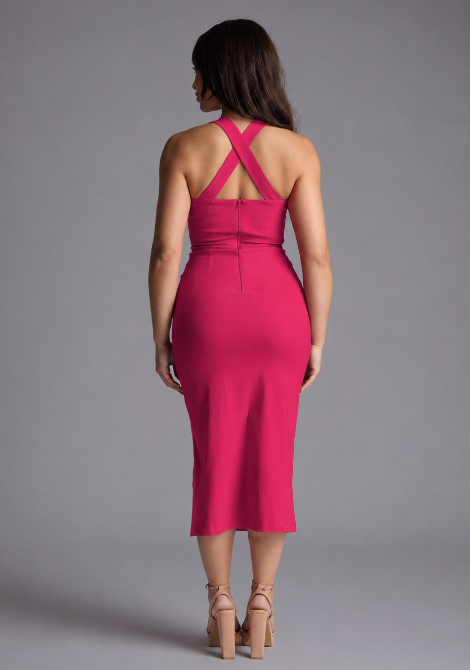 Woman wearing the Vesper Petite Poppy cerise sweetheart cross strap midaxi dress against a grey background, back view showing the cross strap detail
