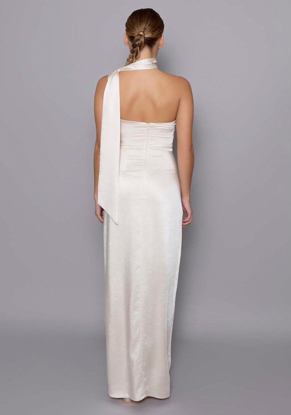  Back view of the VSPR Cordula cream dress featuring a clean zip closure, subtle draping, and a softly contoured silhouette that hugs the frame with a satin sheen.