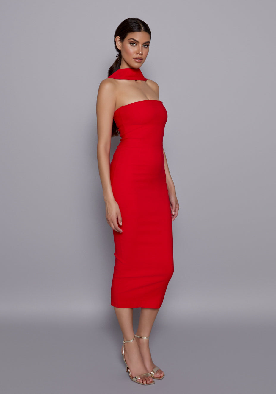 Side-front view of the VSPR Dion Red Midaxi Dress showing the contoured bodycon silhouette, structured collar, and clean straight neckline.