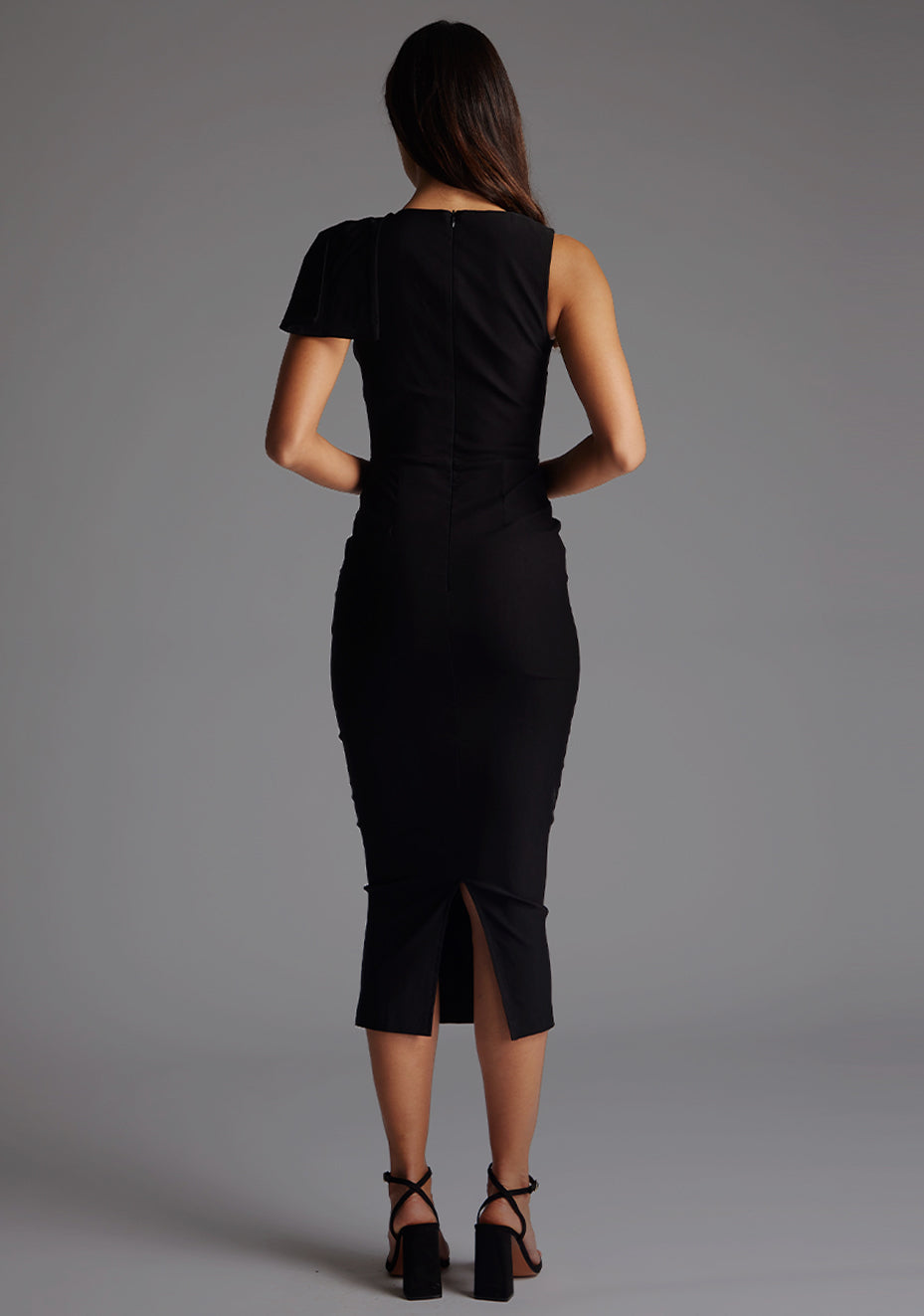Back image of a model wearing the Vesper Elmira Gathered Shoulder Bodycon Midaxi Dress in Black, featuring a sleek, streamlined silhouette and polished finish.