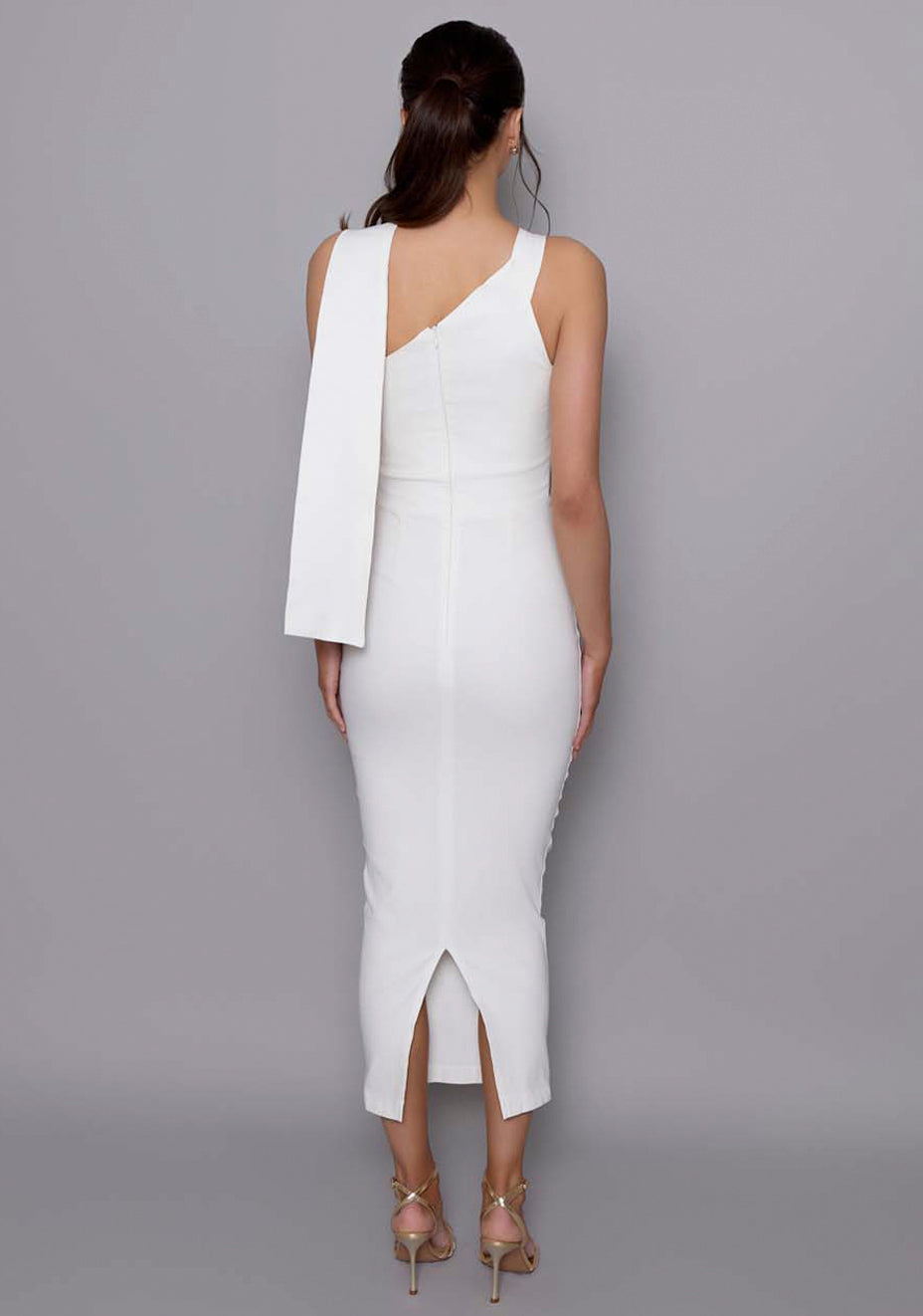 Back view of the VSPR Everest ivory dress featuring a dramatic draped sash and clean zip closure, emphasizing the structured fit and fluid movement.