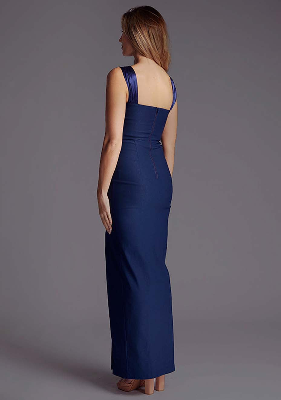 Side back image of a model wearing the Vesper Fame Satin Strap Maxi Dress in Navy, displaying the clean lines and elegant satin straps from a rear angle.