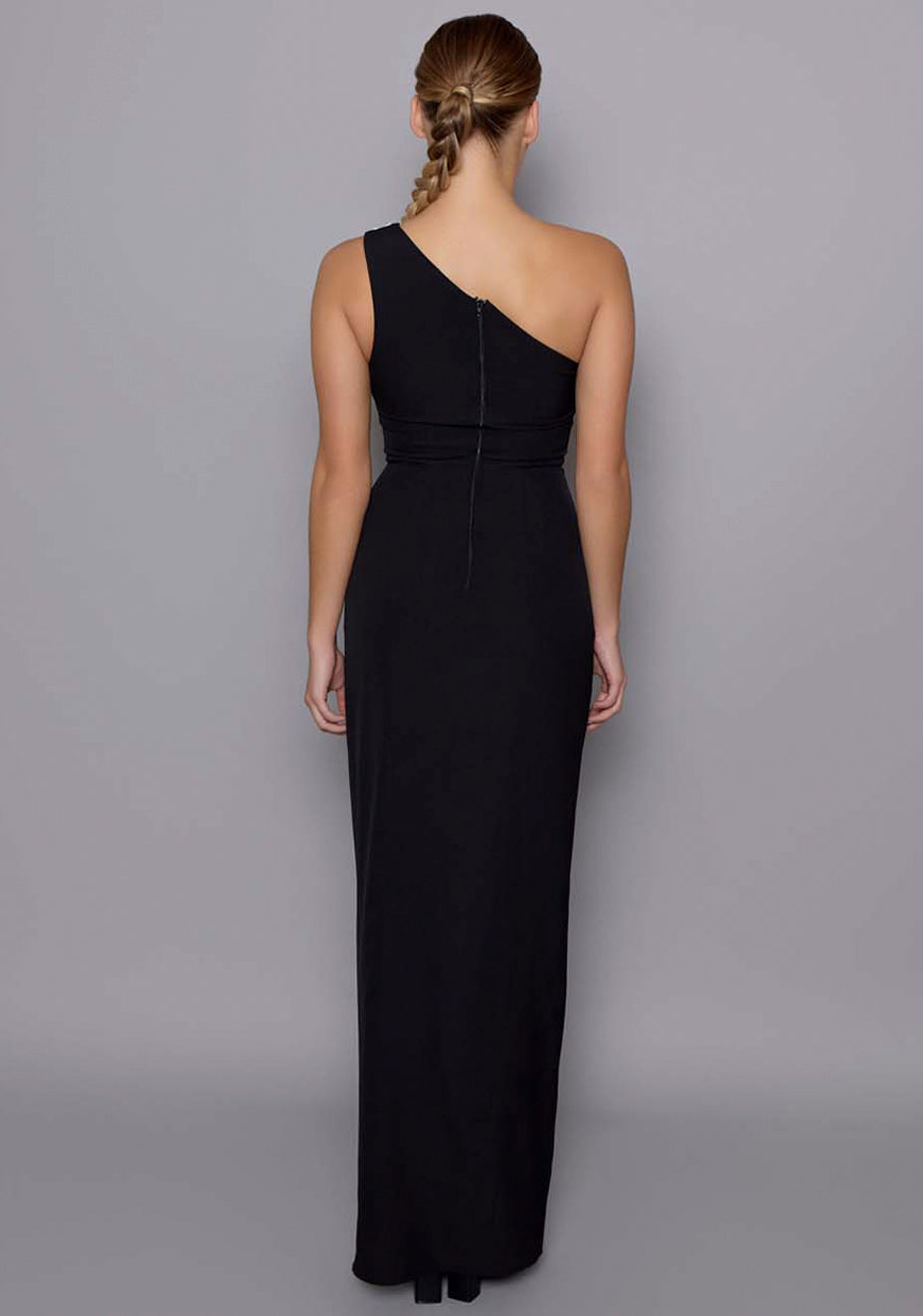 Back view of the VSPR Fliss dress revealing the clean center‑back zip fastening, sculpted fit through the waist and hips, and effortless drape of the maxi hem.