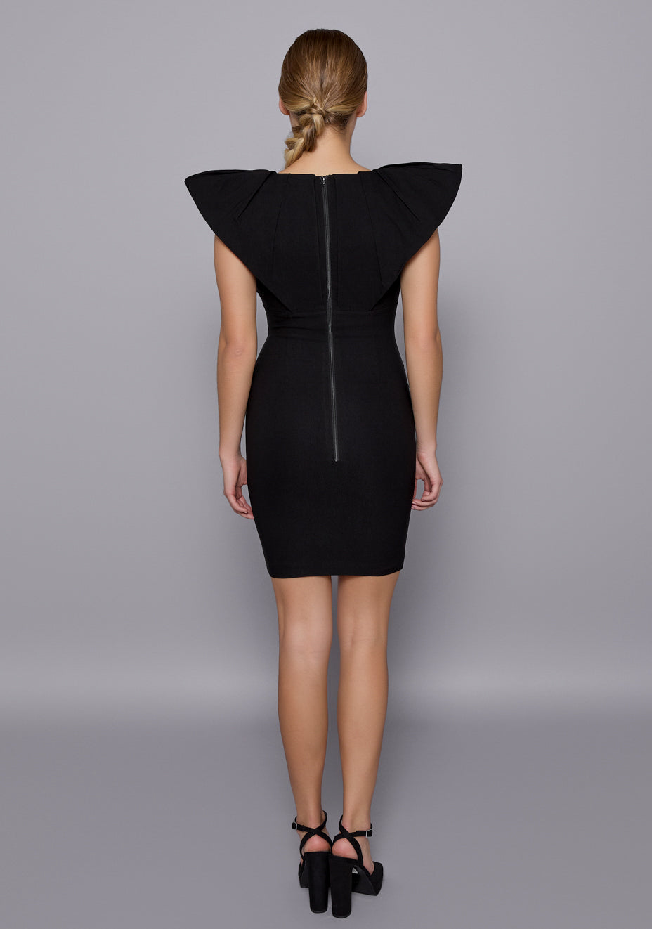 Back view of the Joss Mini Dress reveals the seamless zip closure and smooth fabric finish, emphasizing the clean lines and tailored fit.