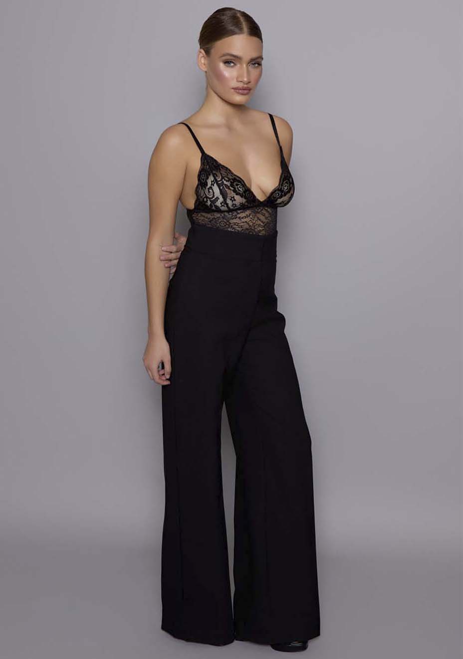 Side-front view of the VSPR Lumi high-waist trousers showing the elongated leg line, relaxed wide-leg fit, and sculpted waist detail.