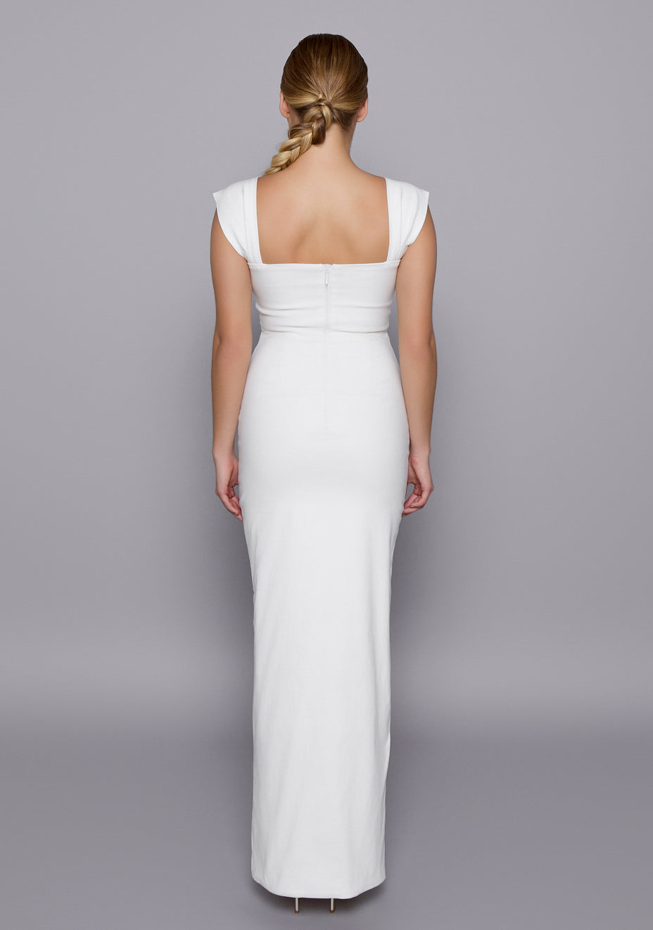 Back view of the VSPR Morgan Dress showing the clean zip closure, sculpted fit through the waist and hips, and the smooth fall of the ankle-length skirt in soft ivory.