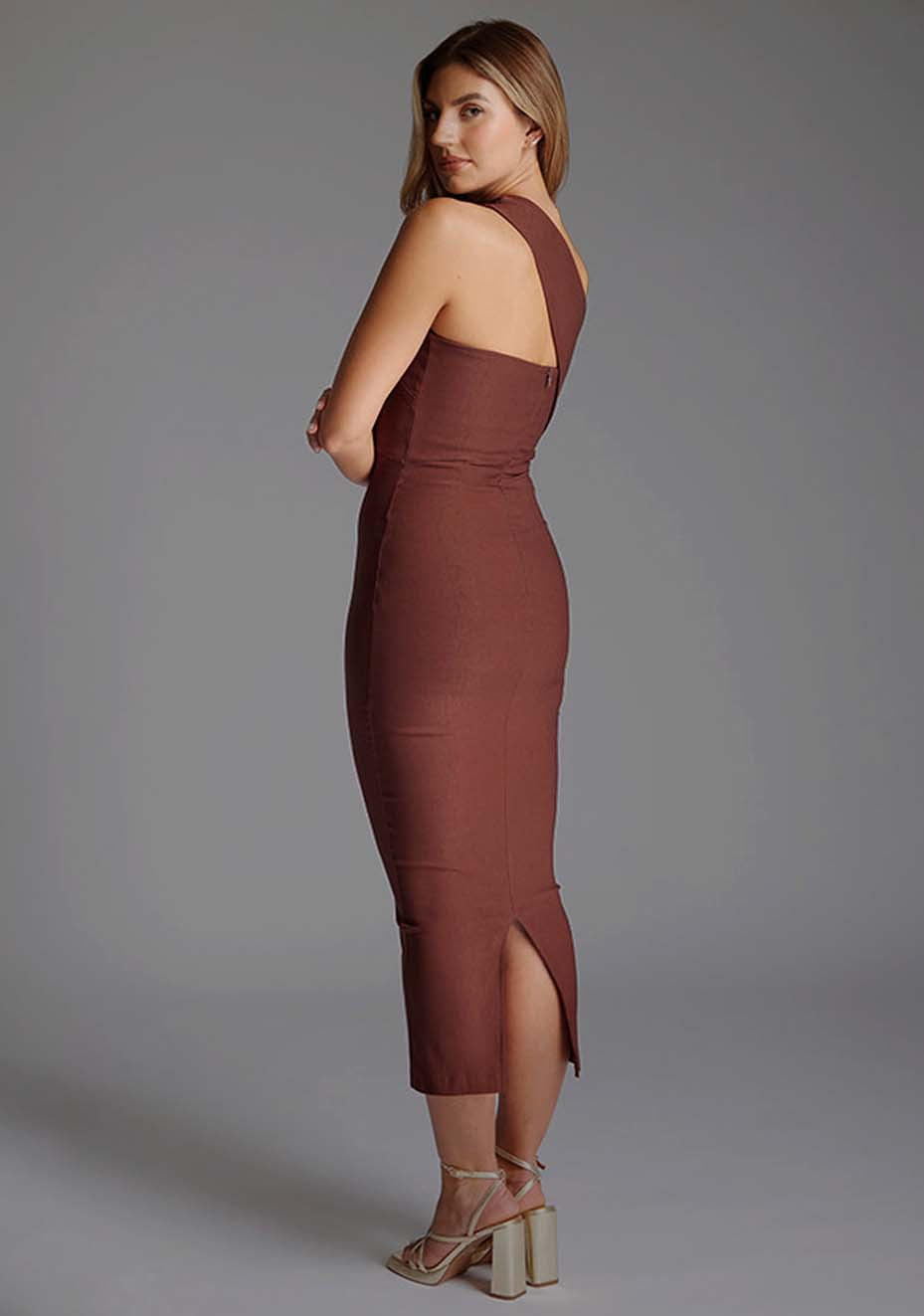 Side back image of a model wearing the Vesper Teo One Shoulder Bodycon Midaxi Dress in Chocolate revealing the subtle back contour and elegant midaxi cut.