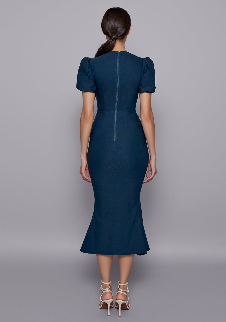Back view of the VSPR Valencia Midaxi Dress with a concealed zip closure and contoured silhouette, emphasizing the clean lines and elegant fit.
