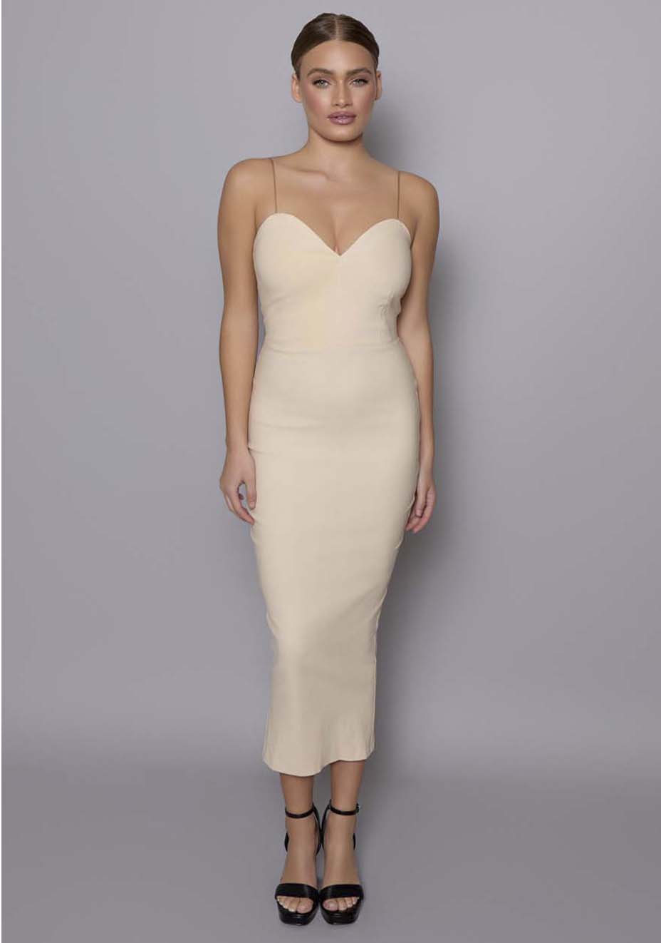 Model wearing the VSPR Viola stone midaxi dress with a plunge sweetheart neckline and thin cami straps, styled in a minimalist studio setting with a neutral backdrop.