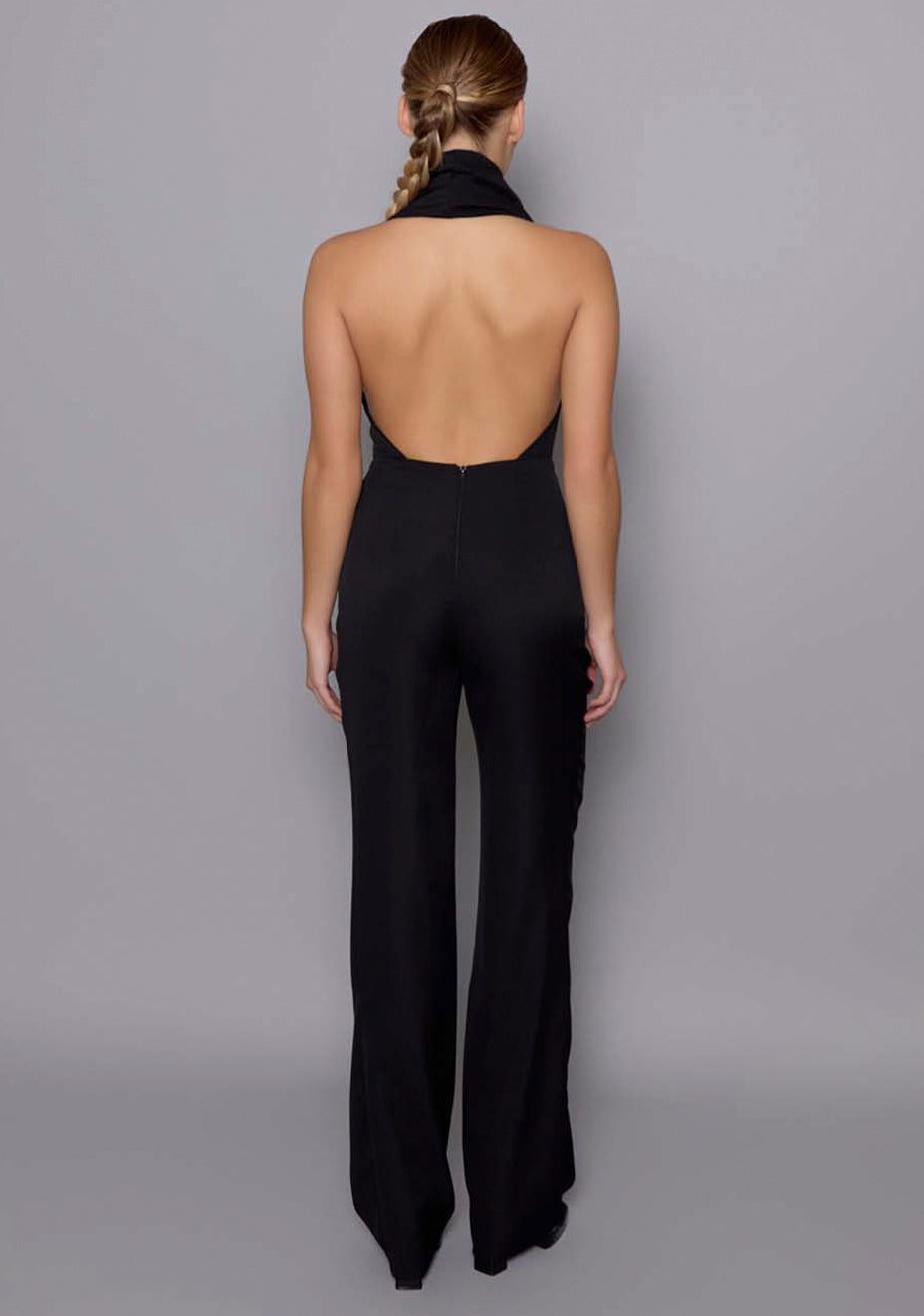 Back view of the VSPR Zinna Jumpsuit with clean lines and tailored fit, showing the sleek satin fabric and seamless construction from behind