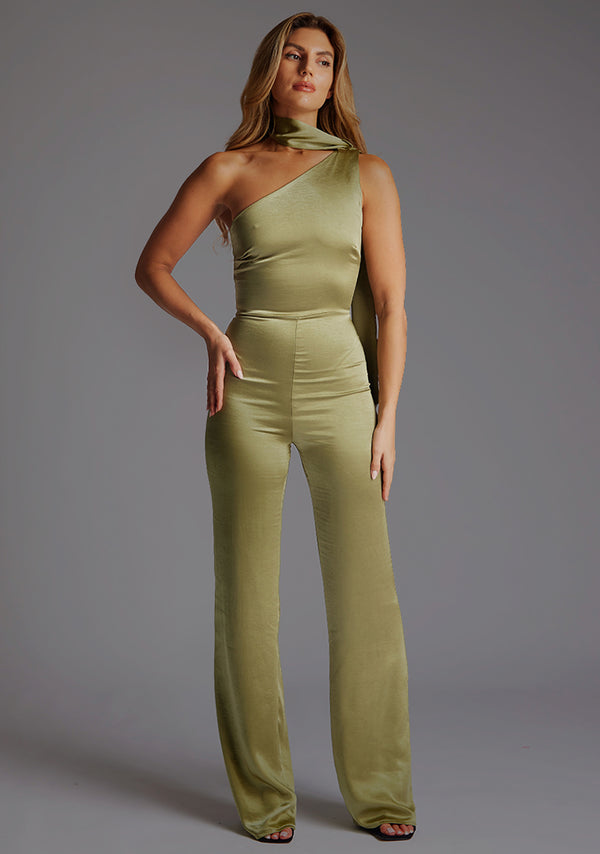 Front image of a model wearing a olive collar detail jumpsuit with asymmetric one-shoulder design and a unique collar detail and wide leg that adds sophistication. The design featured is the Vesper Kaitlin Olive Collar Detail Jumpsuit.